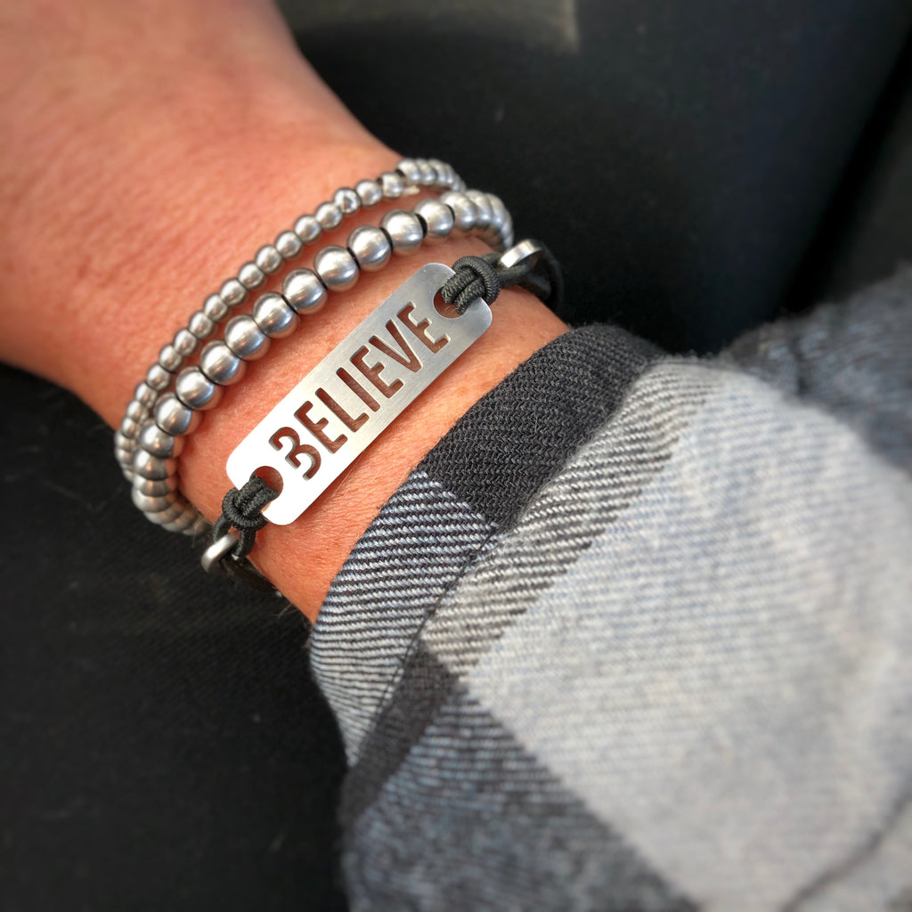 Strength, Courage, Believe, Breathe, Hope, Inspire, Live & Dream - Available in Black or Pink adjustable stretchy bracelet.  